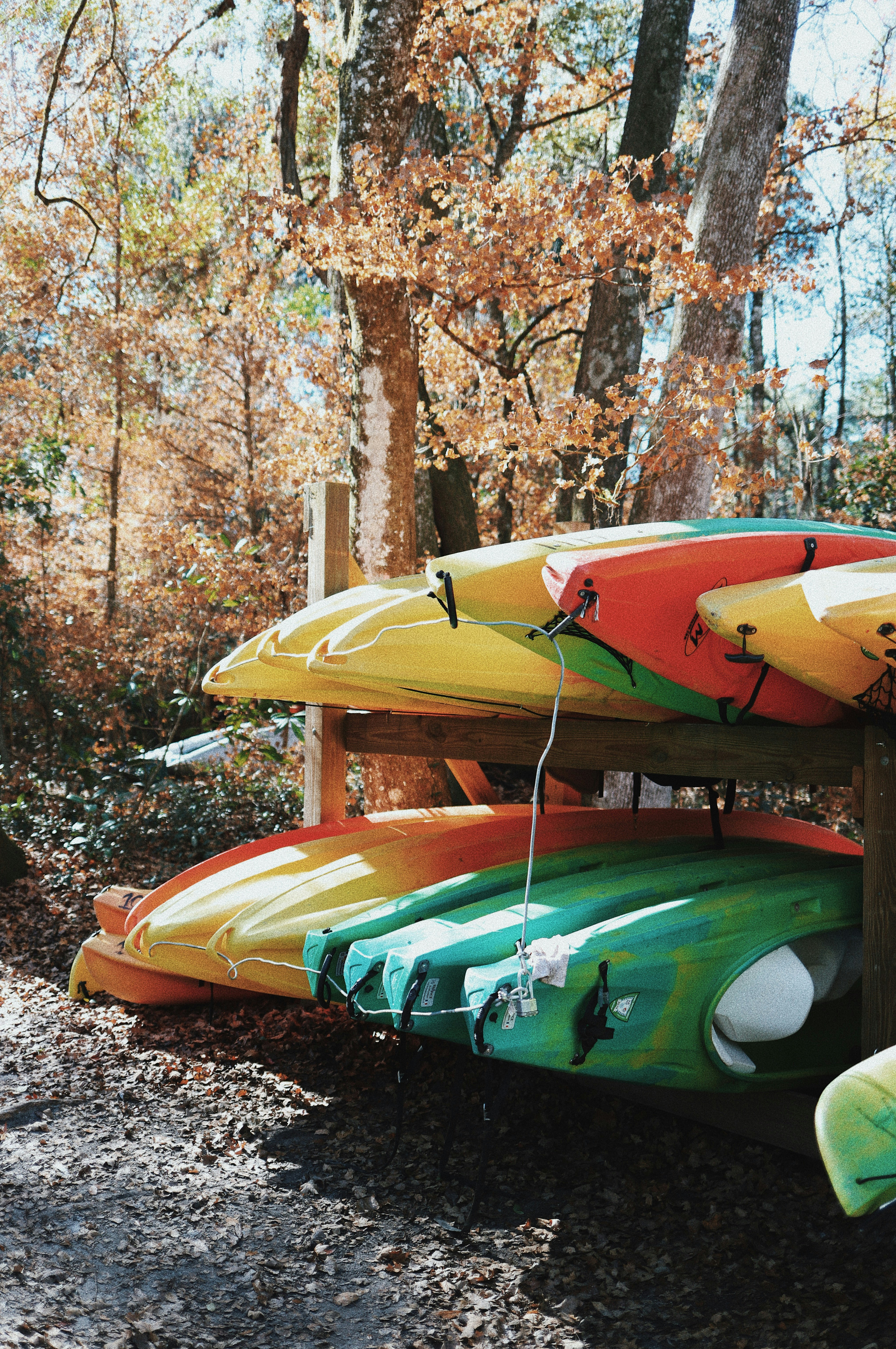 green and brown wooden boat on body of water during daytime